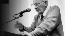 Hugh Nibley speaks at an air-quality symposium in 1989. Image via Deseret News.