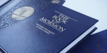 The Book of Mormon with other books.